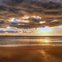 Buy canvas prints of The clouds cant stop the sunset by Paul Madden