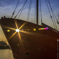 Buy canvas prints of Sunbeams through the lightship by Paul Madden