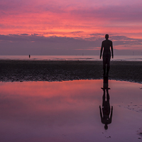 Buy canvas prints of Pink skies at Crosby Beach by Paul Madden