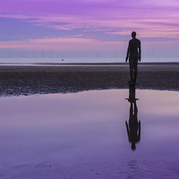Buy canvas prints of Pink and purple sunset at Crosby Beach by Paul Madden
