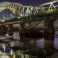 Buy canvas prints of Runcorn Bridge At Night by Paul Madden