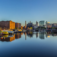 Buy canvas prints of Sunrise at the Salthouse Dock by Paul Madden