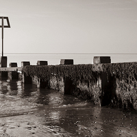 Buy canvas prints of High Tide Marker & Groynes, Swanage Bay by Darren Galpin