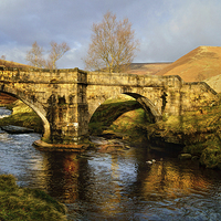 Buy canvas prints of Slippery Stones Packhorse Bridge by Darren Galpin