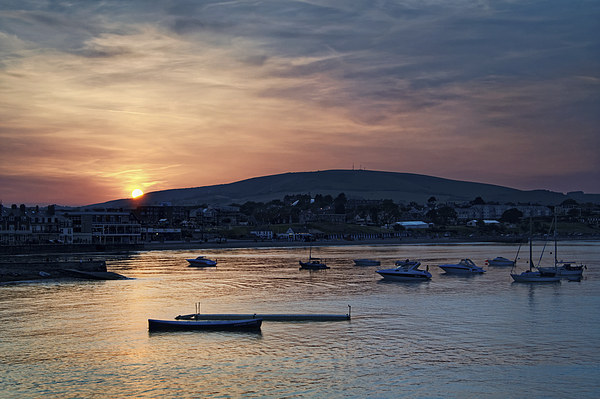Sunset over Swanage and Purbeck Hills  Picture Board by Darren Galpin