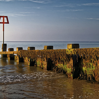 Buy canvas prints of Sea Defences at Swanage Bay  by Darren Galpin