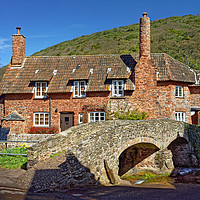 Buy canvas prints of Allerford Packhorse Bridge and Cottage             by Darren Galpin