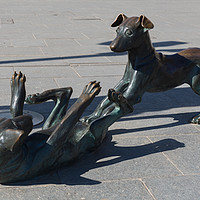 Buy canvas prints of bronze dogs santa eulalia, ibiza by kevin murch