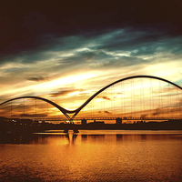 Buy canvas prints of  Infinity Bridge Sunset by Michael McNeil