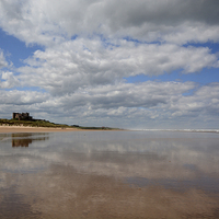 Buy canvas prints of  Bamburgh Castle Reflection by Shaun Cope