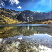 Buy canvas prints of The Gylders relecting in llyn Idwal by Pete Lawless