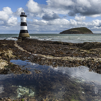 Buy canvas prints of  Penmon Lighthouse and rock pool by Pete Lawless