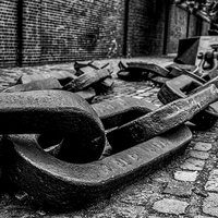 Buy canvas prints of Anchor Chain in the Street by Jon Mills