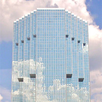 Buy canvas prints of Cloud Reflecting Mirror Building by Tyrone Boozer