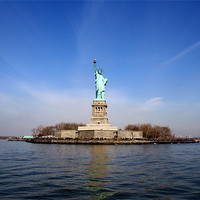 Buy canvas prints of The Statue of Liberty from Afar by Megan Winder
