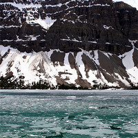 Buy canvas prints of Icy Lake with Mountains by Megan Winder