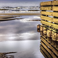 Buy canvas prints of Groyne reflects at low tide. by Avril Harris