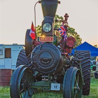 Buy canvas prints of Moose traction engine at sunset by Avril Harris