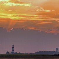 Buy canvas prints of Sun rays over Happisburgh by Avril Harris
