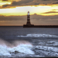 Buy canvas prints of  Roker pier and lighthouse sunrise by Avril Harris