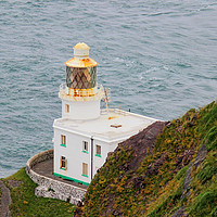 Buy canvas prints of Hartland Point Lighthouse Devon by Avril Harris